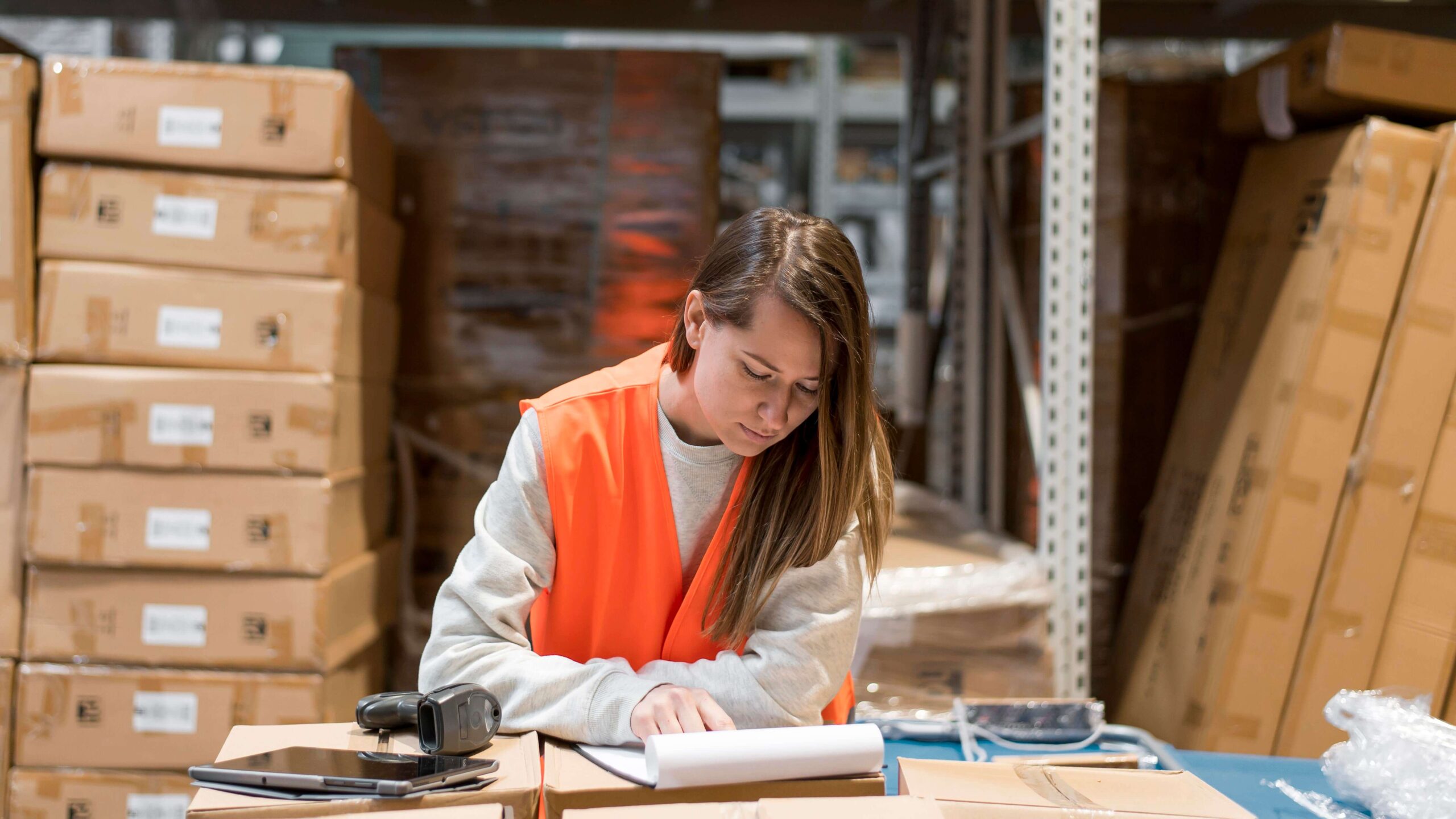 medium-shot-woman-reading-document Processing parcel