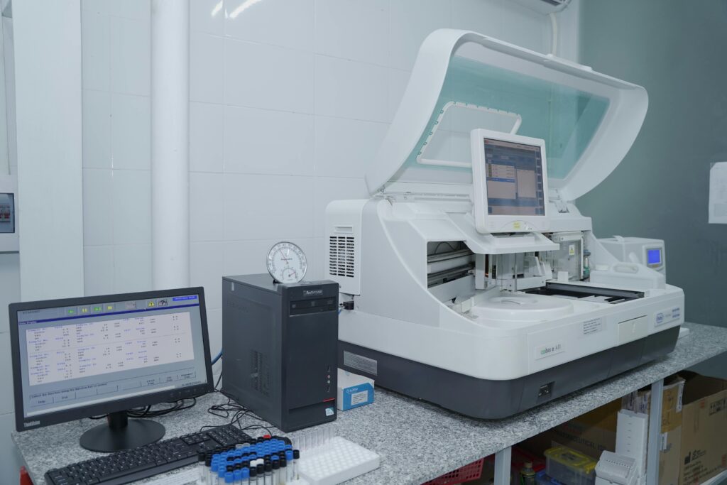 High-tech laboratory equipment with computer system in lab setting.