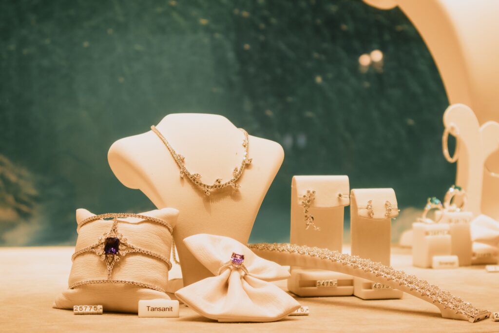 pexels-photo-28146843-28146843 Luxury jewelry set elegantly displayed with necklaces and rings in a store setting.