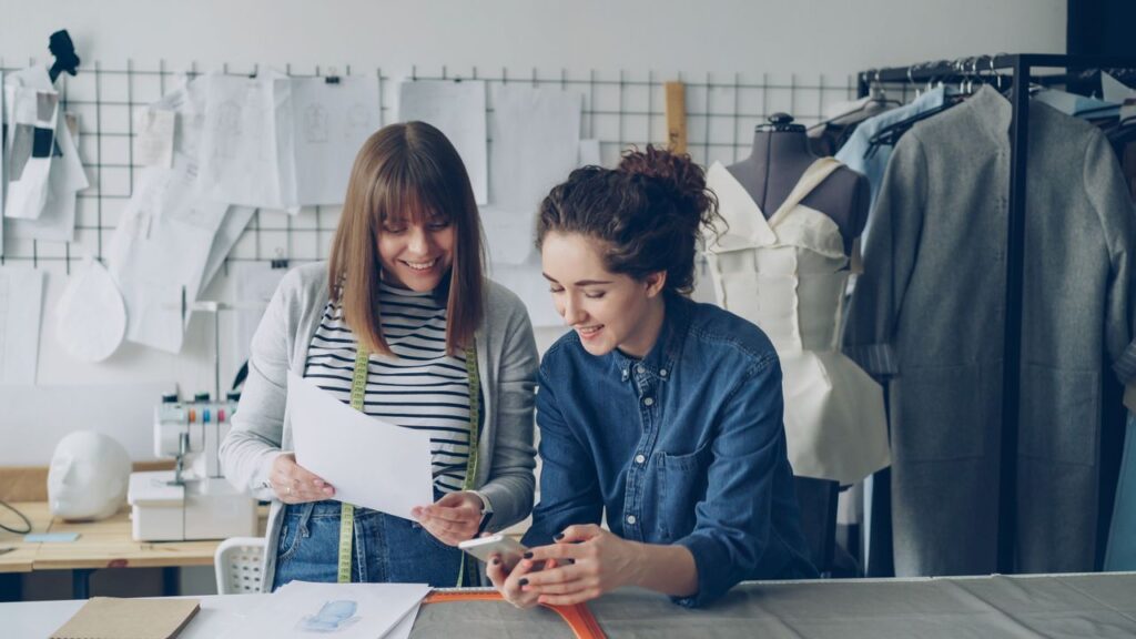 pexels-photo-36731569-36731569 Two fashion designers working together on a project in their workshop.