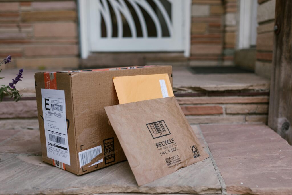 pexels-photo-7363199-7363199-1 Close-up of delivered packages on doorstep, symbolizing online shopping and home delivery.